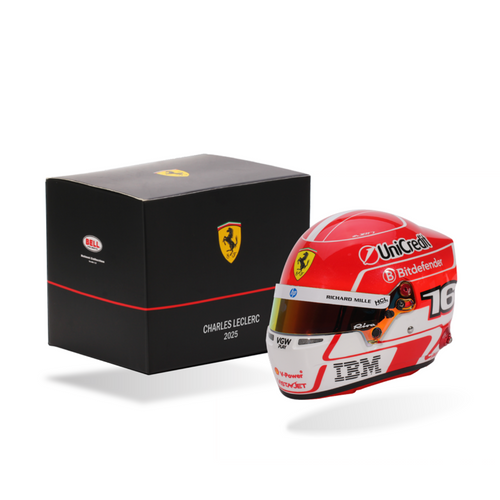 Ferrari racing helmet with branded box on a white background