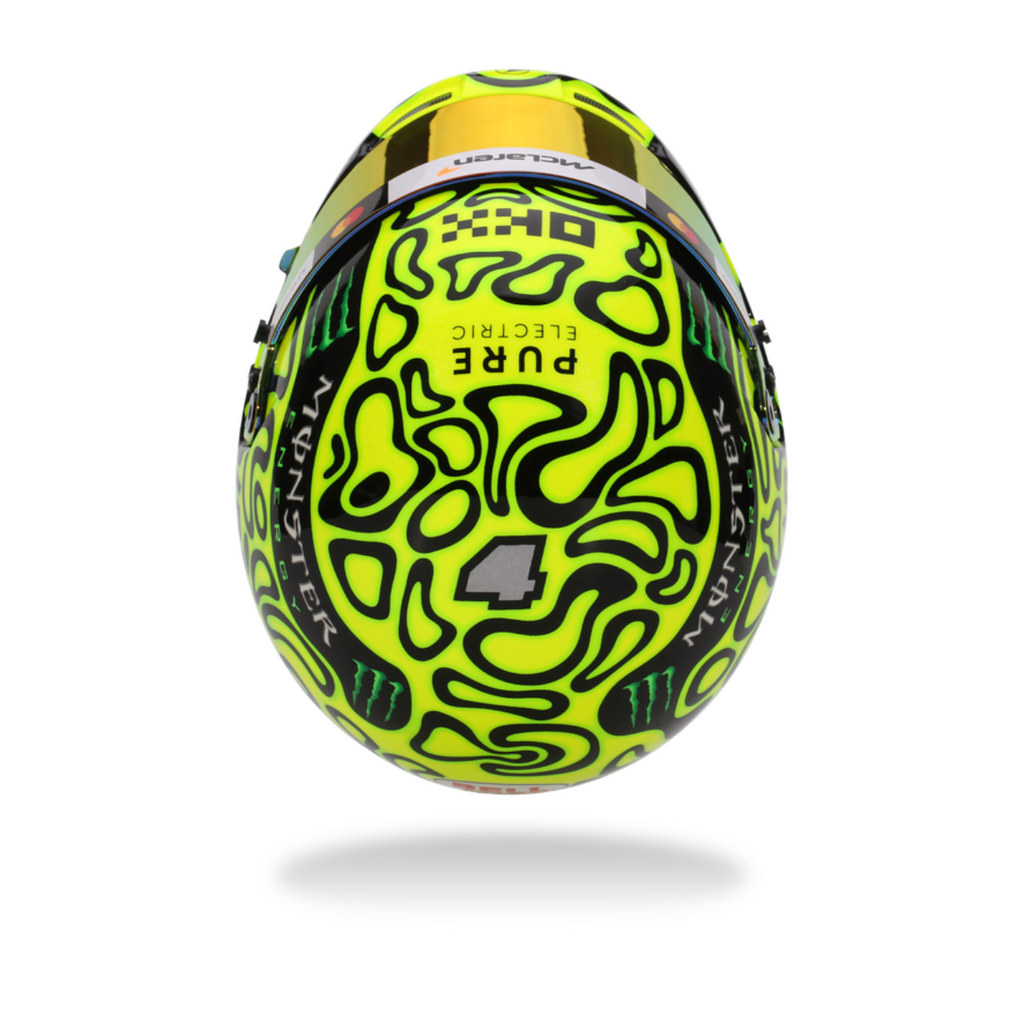 Yellow and black helmet with intricate design on a white background